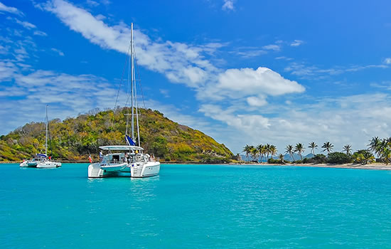 Catamaran on turquoise sea near Mayreau Island, Caribbean Sea